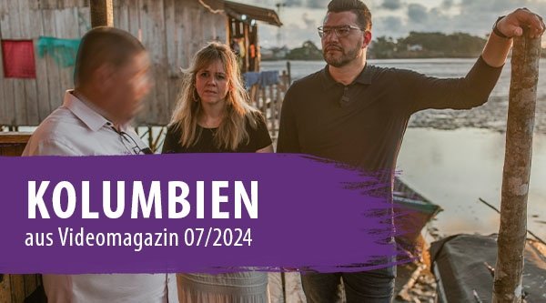 Eine Frau und ein Mann aus Europa treffen einen kolumbianischen Pastor an einem Bootssteg